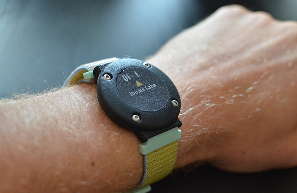 An Iterate Labs wearable shown on a person's wrist.