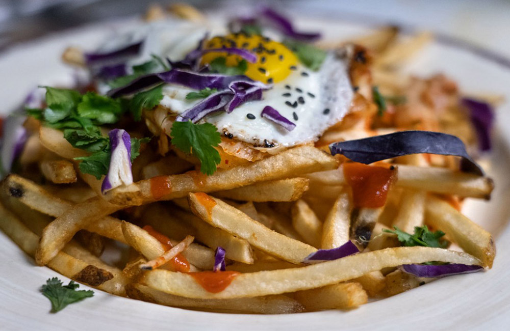 Farther Farms' fries incorporated into a kimchi poutine dish served at Luna Inspired Street Food in Ithaca, New York.