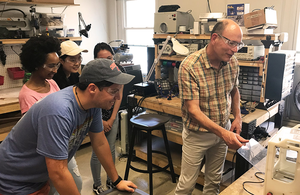Members of the Black Cat hardware team watch Steve Supron give a tutorial in the Prototyping Lab at Rev.