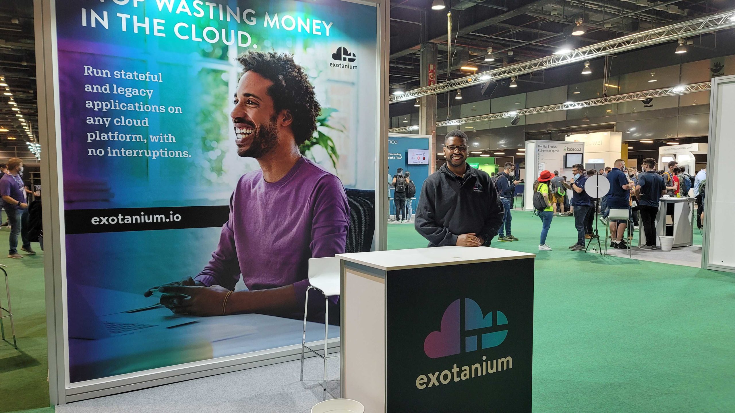 Exotanium CEO Hakim Weatherspoon standing at a Exotanium conference booth
