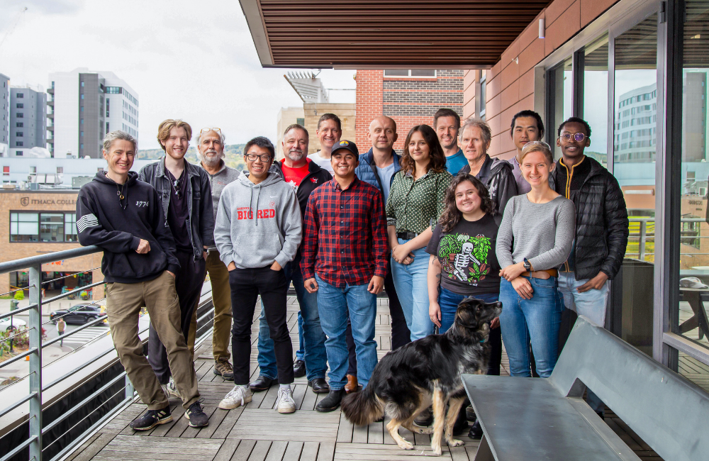 the manufacturing cohort stands on a balcony