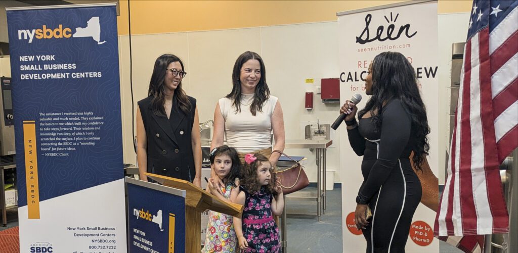 Adrienne Bitar and Jennifer Han receiving the NY SBDC Award